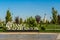 UZBEKISTAN, TASHKENT - SEPTEMBER 15, 2023: Inscription Yangi Uzbekistan and Monument of Independence in the form of a