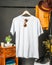 The v-neck shirt mockup displays a tastefully decorated garment, showcasing a simplistic yet stylish design while hanging