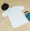 A v-neck shirt mockup featuring minimalist decoration, beautifully arranged in a flat lay that accentuates its understated charm