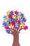 vAbstract tree with colorful vibrant puzzle pieces on off white background. Autism Awareness Day, World Autism Day