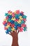 vAbstract tree with colorful vibrant puzzle pieces on off white background. Autism Awareness Day, World Autism Day