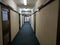 Vacant corridor or abandoned corridor with carpeted floor