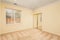 A vacant room with cream walls and beige carpet. Great for virtual staging