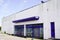 Vacant storefront with metallic closed curtains windows abandoned shop business