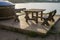 Vacant wooden table and chairs overlooking a lake