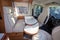 Vacation campervan with white luxury interior table wooden and seat in modern new motor home for vanlife concept