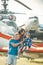 Vacation concept. Happy family enjoy summer vacation at military air show. Child with mother and father sit on plane