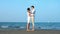 Vacation Couple at beach romantic holding hands and kissing