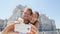 Vacation couple taking selfie photo on smartphone in Madrid