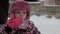 Vacation, game, family concept - slo-mo authentic cute little girl child 3-4 years old in winter purple hat with