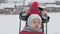 vacation, game, family concept - slo-mo authentic happy smiling young mother pushes sled with toddler preschool son