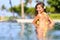 Vacation getaway woman swimming in a tropical pool