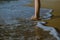 Vacation and holiday concept,Woman legs or foot walking on the beach,Close up