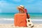 Vacation holiday traveling and planning with old suitcase guitar and hat on the sand beach. Travel in the holiday. Summer and Tr