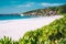 Vacation holiday wallpaper postcard background. Grand Anse tropical beach in La Digue, Seychelles. Famous granite rock