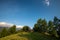 Vacation on the mountain wood cabin surrounded by trees , clear blue sky in summertime