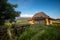 Vacation on the mountain wood cabin surrounded by trees , clear blue sky in summertime