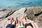 Vacation relax: three people take a sun bath after swimming in c