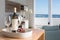 Vacation room with sea view and table with bottle of wine and glasses