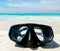 Vacation Start Here Concept, Scuba Diving Equipment On The White Sea Sand Beach with Crystal Clear Sea and Sky in Background used