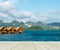 Vacation Start Here Concept, Wooden Perspective Floor with Beautiful Wooden Floating House in Peaceful View of Ratchaprapa dam