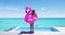 Vacation travel fun. Funny woman dancing happy and cheerful and funny with flamingo swimming pool float around waist