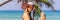 Vacation on tropical island. Woman in hat enjoying sea view from wooden bridge BANNER, LONG FORMAT