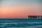 Vacation, warm countries concept. Pier in sea after sunset. Place for text. copy space