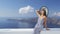 Vacation woman enjoying sun elegant at Santorini