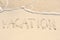Vacation Written in Sand on Beach