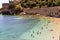 Vacationers bathe and sunbathe against the background of the ancient fortress wall Alanya, Turkey