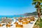 Vacationers on long Borsh beach with clear blue water. Albania. Cloudless sky. Ionian Sea