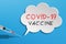 Vaccinaciton concept, speech bubble with syringe vaccine icon on blue background