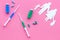 Vaccination as way to save healthy family. Syringe with colored vaccine near silhouette of family on pink background top