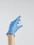 Vaccination Coronavirus Covid-19 Concept. Hand in medical glove holds ampoule with vaccine