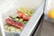 Vacuum bags with different vegetables in fridge. Food storage