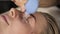 Vacuum face and decolletage massage, beautician does massage with vacuum banks