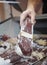 Vacuum packaging with smoked and dried sausage on the counter of the butcher shop window food blurred background