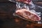 Vacuum packed fresh beef  top blade steak for sous vide cooking  on dark old wooden background, top view with space for text