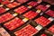 Vacuum-packed red Iberian jamon, spanish ham, in plastic package on the famous market in Barcelona, Catalonia, Spain. 30