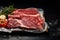 Vacuum sealed dry aged steaks   tomahawk, T bone, club   on black stone