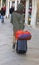 Vagabond with suitcase luggage trolley in Venice in Italy