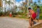 Vailala, Wallis and Futuna. Indigenous aboriginal Polynesian people are playing petanque. Uvea island. Men in skirts lava-lava.