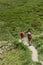 Val d`Aosta, Italy, July 5 2018 two hikers walking on a mountain trial
