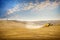 Val D& x27;Arbia. Siena. Wheat harvest on the rolling Tuscan hills at sunset. Italy.