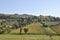 Val d`Enza panoramas with hills, cypresses, fields and vineyards