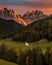 Val Di Funes, Dolomites, Italy - The beautiful St. Johann Church at South Tyrol with the Italian Dolomites and colorful sunset