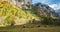 Val di Mello, Valtellina IT, Autumn landscape with grazing cows