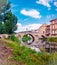 Valderrobres, Spain - July 7, 2021: Stone bridge over the river makes the entrance to the old medieval city of Valderrobres