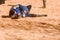 Valencia, Spain - January 27, 2019: An actor disguised as a Medievale knight lying on the ground defeated after a sword battle in
